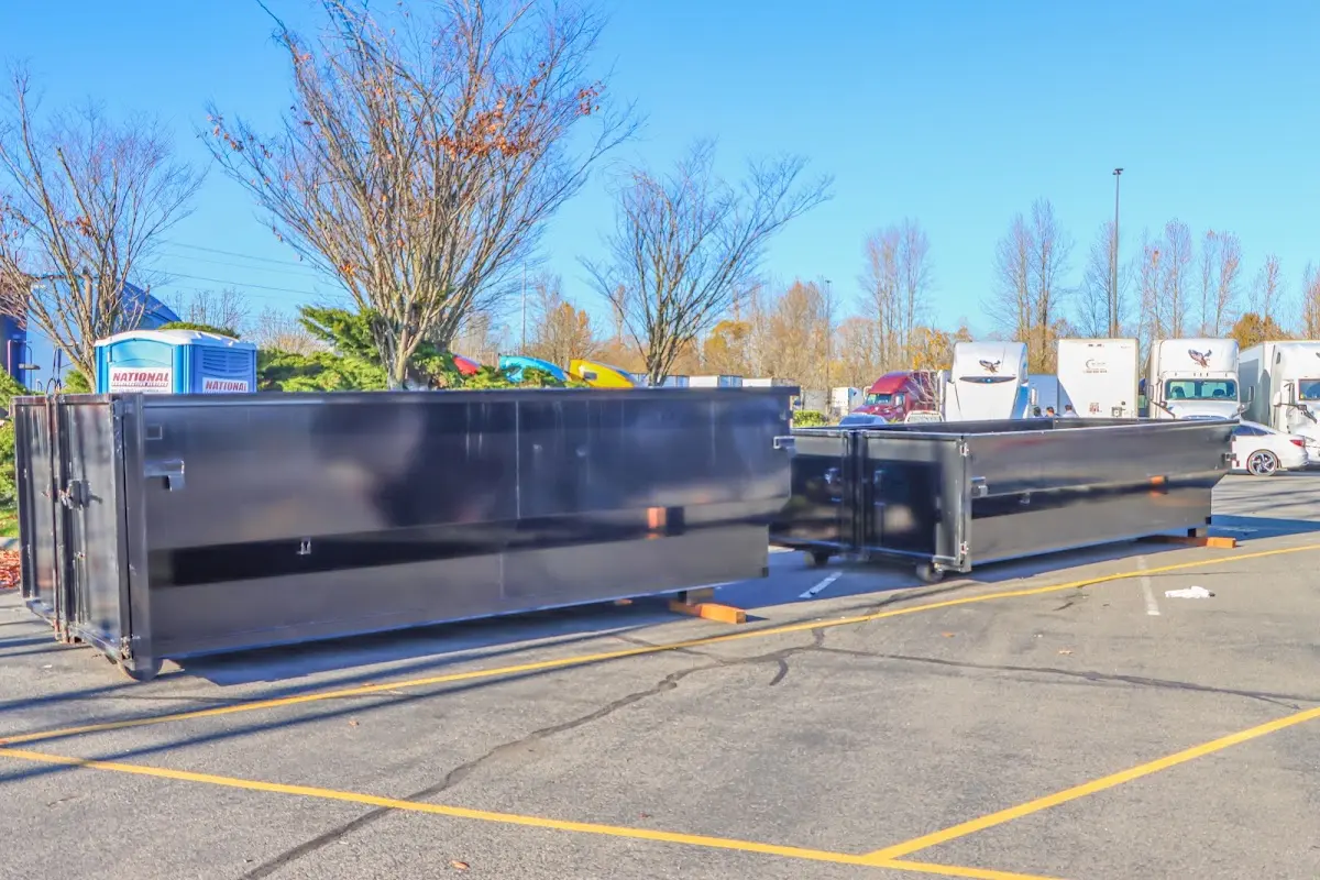 Professional dumpster rental service with roll-off container on residential driveway in Sammamish